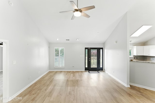 8808 Cedar Springs Ln, Knoxville, TN 37923 - unfurnished living room featuring ceiling fan, light wood-type flooring, and high vaulted ceiling