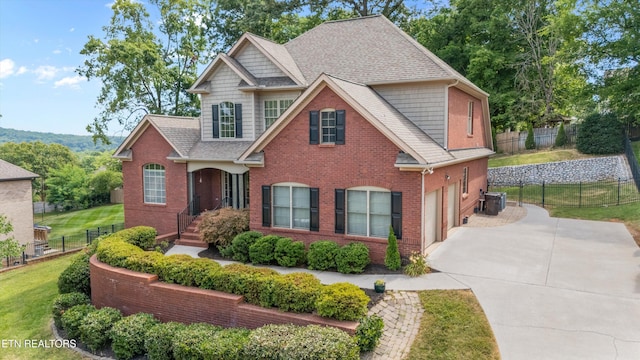 1269 Bentley Park Ln, Knoxville, TN 37922 - view of front of house with driveway, a garage, brick siding, and a shingled roof