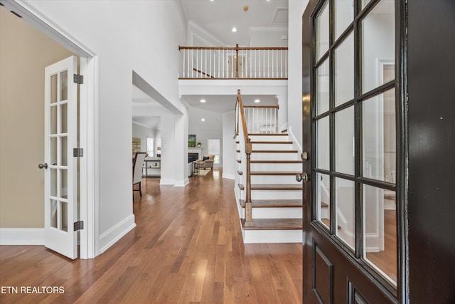1269 Bentley Park Ln, Knoxville, TN 37922 - entryway featuring a towering ceiling, ornamental molding, wood finished floors, and stairs