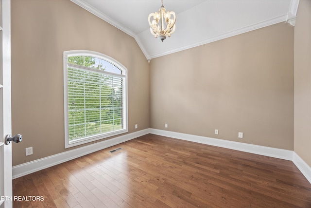 1269 Bentley Park Ln, Knoxville, TN 37922 - spare room featuring crown molding, a chandelier, vaulted ceiling, and hardwood / wood-style floors