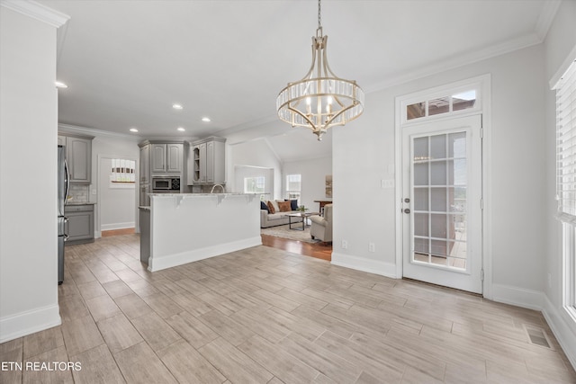 1269 Bentley Park Ln, Knoxville, TN 37922 - kitchen with gray cabinetry, stainless steel appliances, open floor plan, a kitchen breakfast bar, and healthy amount of natural light