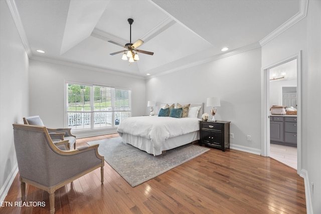 1269 Bentley Park Ln, Knoxville, TN 37922 - bedroom featuring wood-type flooring, ornamental molding, ensuite bath, a tray ceiling, and recessed lighting