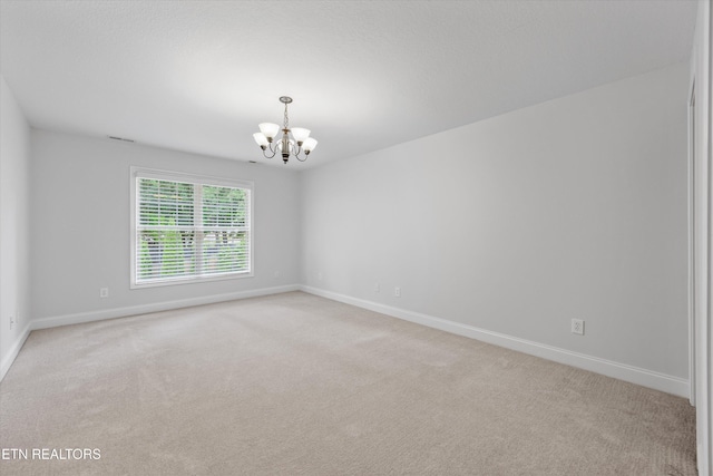1269 Bentley Park Ln, Knoxville, TN 37922 - spare room with a chandelier and light colored carpet