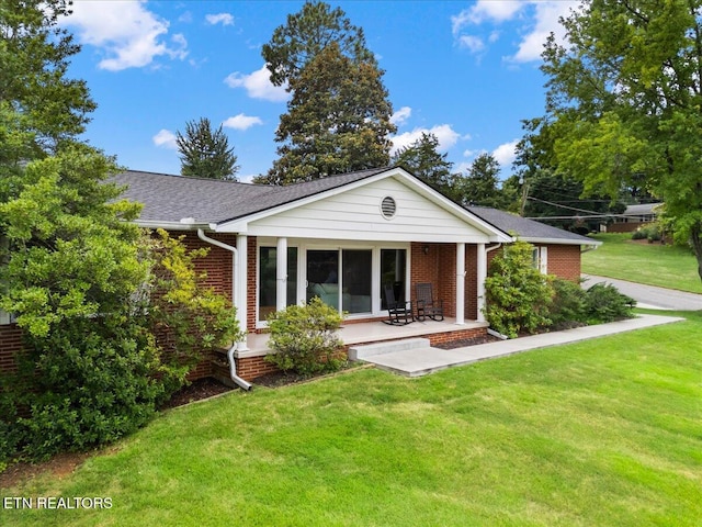 300 Clearfield Rd, Knoxville, TN 37922 - back of house featuring brick siding, a lawn, and a porch