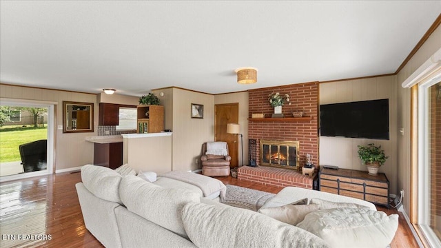 300 Clearfield Rd, Knoxville, TN 37922 - living room featuring wood finished floors, ornamental molding, and a brick fireplace