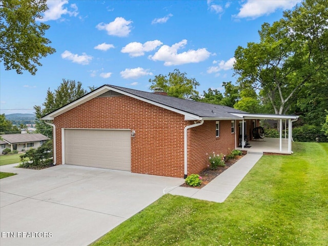 300 Clearfield Rd, Knoxville, TN 37922 - view of side of property featuring brick siding, a lawn, and driveway