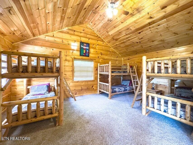2205 Meredith Way, Sevierville, TN 37876 - bedroom featuring vaulted ceiling, carpet, wood ceiling, a wood stove, and log walls