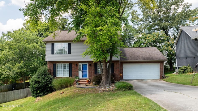 1517 Randal Park Dr, Knoxville, TN 37922 - colonial home with brick siding, an attached garage, driveway, and entry steps