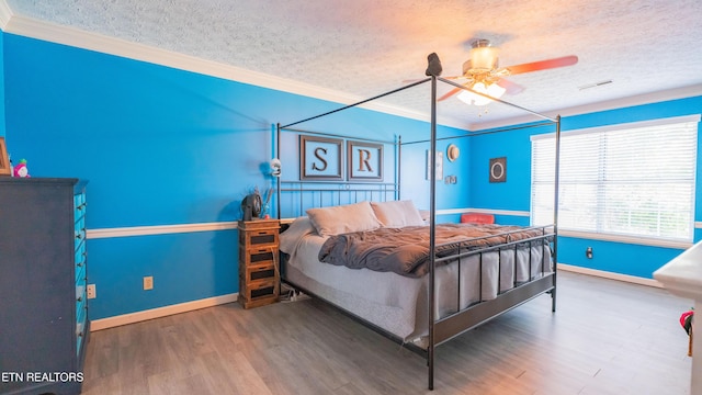 1517 Randal Park Dr, Knoxville, TN 37922 - bedroom featuring a textured ceiling, ornamental molding, wood finished floors, and ceiling fan