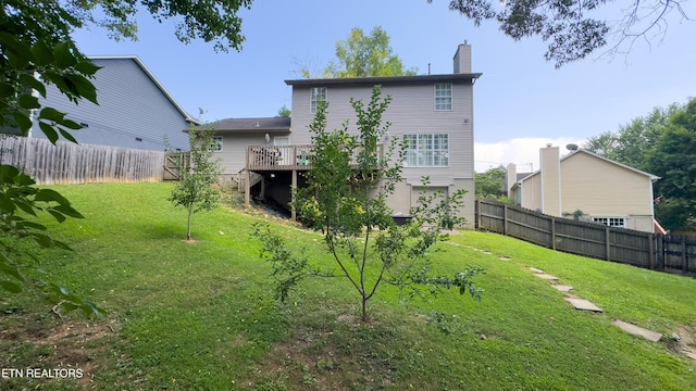 1517 Randal Park Dr, Knoxville, TN 37922 - back of house with a fenced backyard, a chimney, and a wooden deck