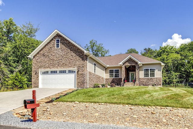 129 Dudi Trl, Vonore, TN 37885 - view of front facade with stone siding, driveway, a front yard, and a garage