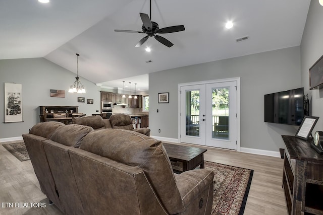 129 Dudi Trl, Vonore, TN 37885 - living area with french doors, lofted ceiling, light wood-style flooring, ceiling fan, and a chandelier