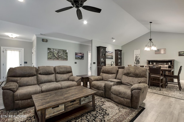 129 Dudi Trl, Vonore, TN 37885 - living room with a ceiling fan, vaulted ceiling, a chandelier, light wood-style floors, and crown molding