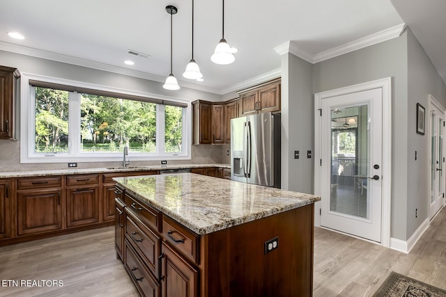 129 Dudi Trl, Vonore, TN 37885 - kitchen featuring stainless steel fridge, light wood-style floors, backsplash, light stone counters, and a kitchen island