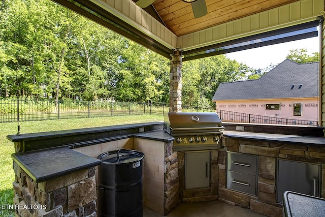 129 Dudi Trl, Vonore, TN 37885 - fenced backyard with area for grilling and a ceiling fan