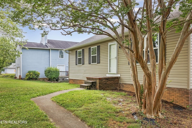 10609 Sprawls Pt, Knoxville, TN 37932 - view of property exterior with a yard and a chimney