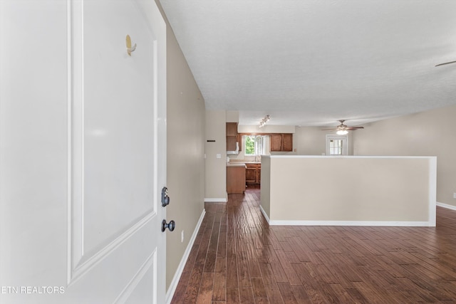 10609 Sprawls Pt, Knoxville, TN 37932 - kitchen with ceiling fan, brown cabinets, light countertops, and dark wood finished floors