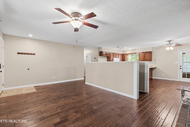 10609 Sprawls Pt, Knoxville, TN 37932 - unfurnished living room featuring a ceiling fan, dark wood finished floors, plenty of natural light, and recessed lighting