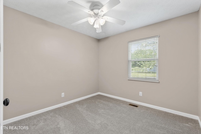 10609 Sprawls Pt, Knoxville, TN 37932 - carpeted spare room featuring baseboards and a ceiling fan