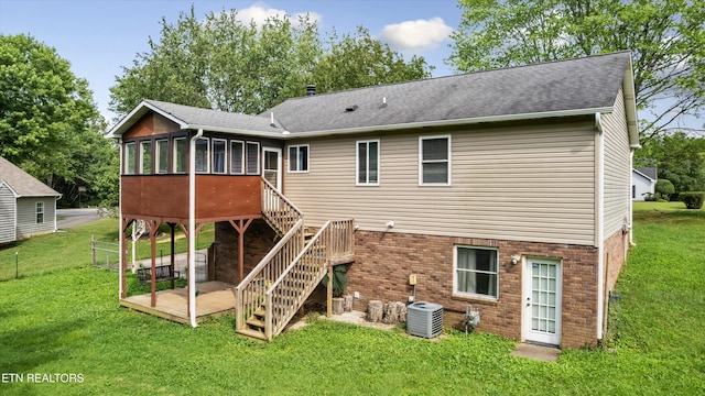 10609 Sprawls Pt, Knoxville, TN 37932 - back of house featuring a sunroom, a yard, brick siding, stairs, and a wooden deck