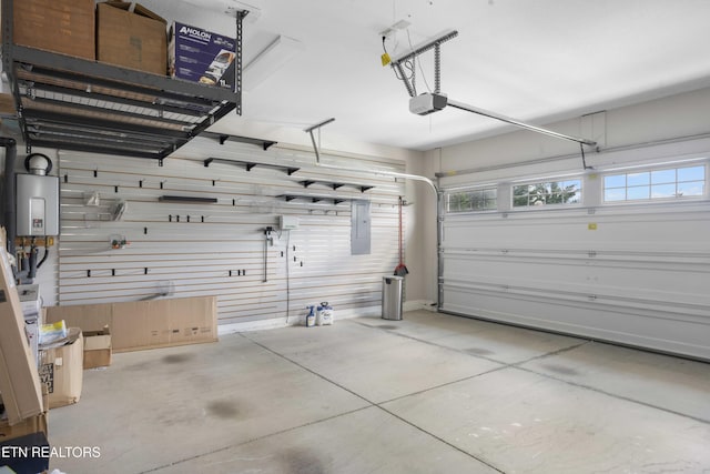 10703 Grantham Ln, Knoxville, TN 37932 - garage featuring electric panel, a garage door opener, and water heater