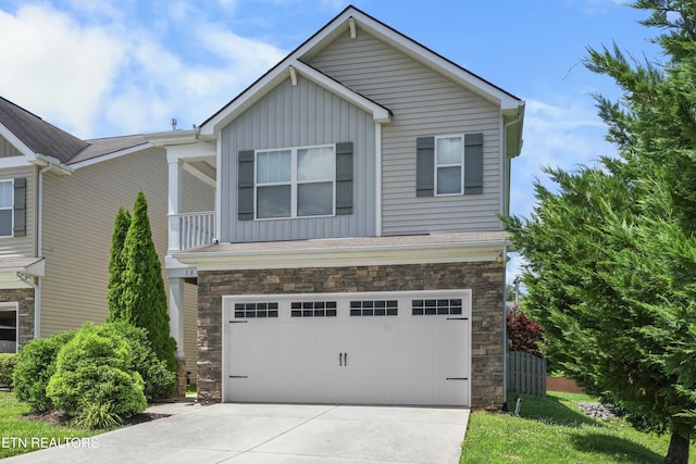 10703 Grantham Ln, Knoxville, TN 37932 - view of front of property with board and batten siding, stone siding, a garage, and driveway