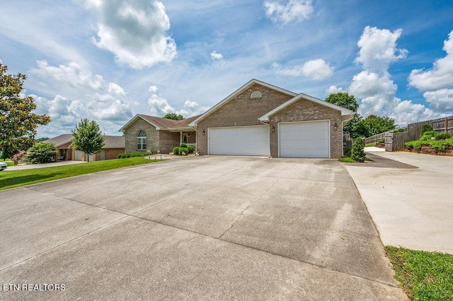 674 Southview Cir, Kodak, TN 37764 - ranch-style house featuring brick siding, concrete driveway, and an attached garage