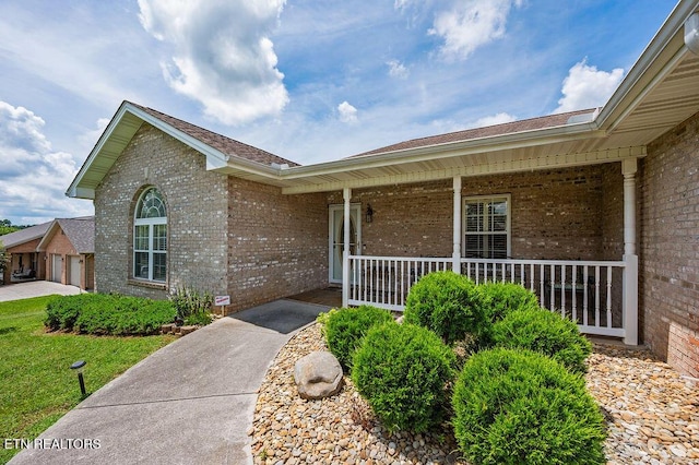 674 Southview Cir, Kodak, TN 37764 - property entrance featuring brick siding and covered porch