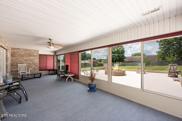 674 Southview Cir, Kodak, TN 37764 - sunroom featuring ceiling fan and a fire pit