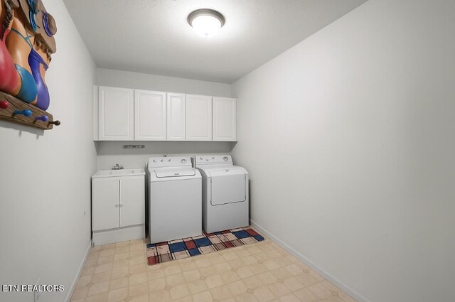 674 Southview Cir, Kodak, TN 37764 - laundry area featuring cabinet space, washing machine and clothes dryer, and light floors