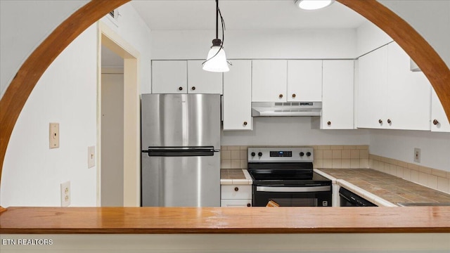 5709 Lyons View Pike Unit 4307, Knoxville, TN 37919 - kitchen with stainless steel appliances, under cabinet range hood, tile counters, hanging light fixtures, and white cabinets