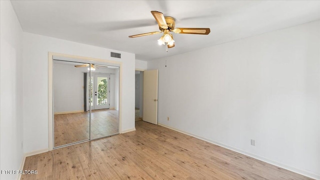 5709 Lyons View Pike Unit 4307, Knoxville, TN 37919 - unfurnished bedroom featuring hardwood / wood-style flooring, a closet, and a ceiling fan