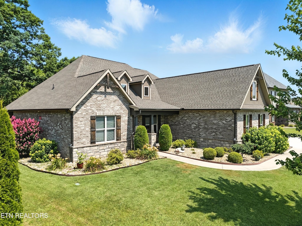 1439 St Thomas Way, Alcoa, TN 37701 - craftsman house with brick siding, a front lawn, and a shingled roof