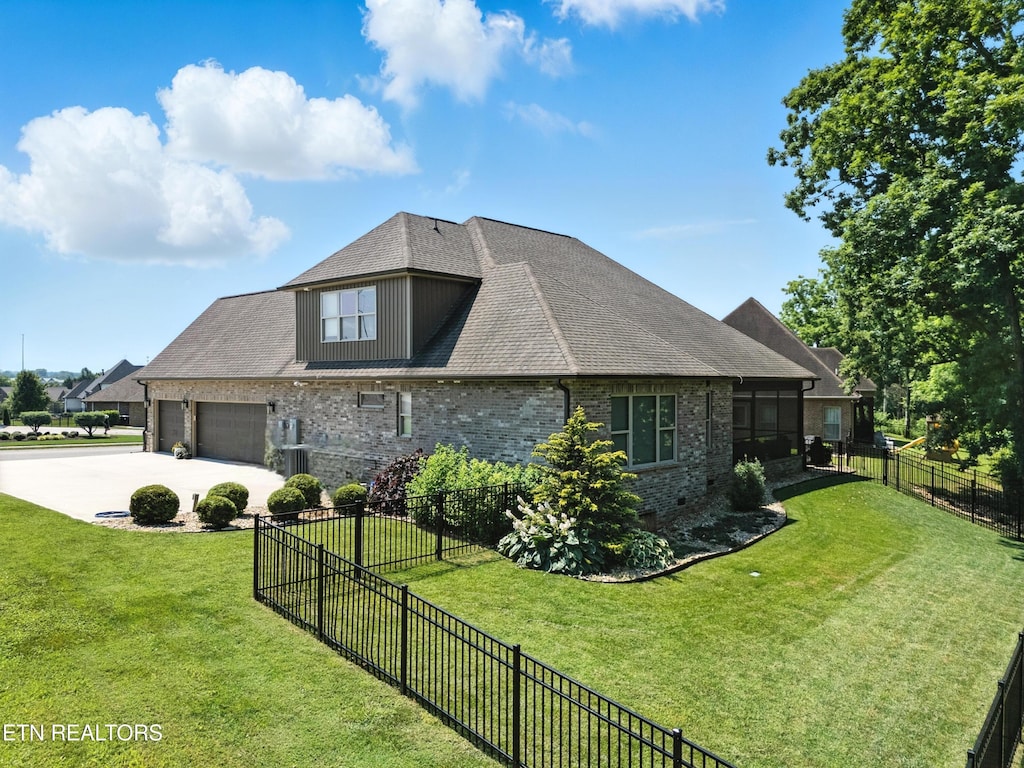 1439 St Thomas Way, Alcoa, TN 37701 - view of home's exterior with concrete driveway, a garage, brick siding, and roof with shingles