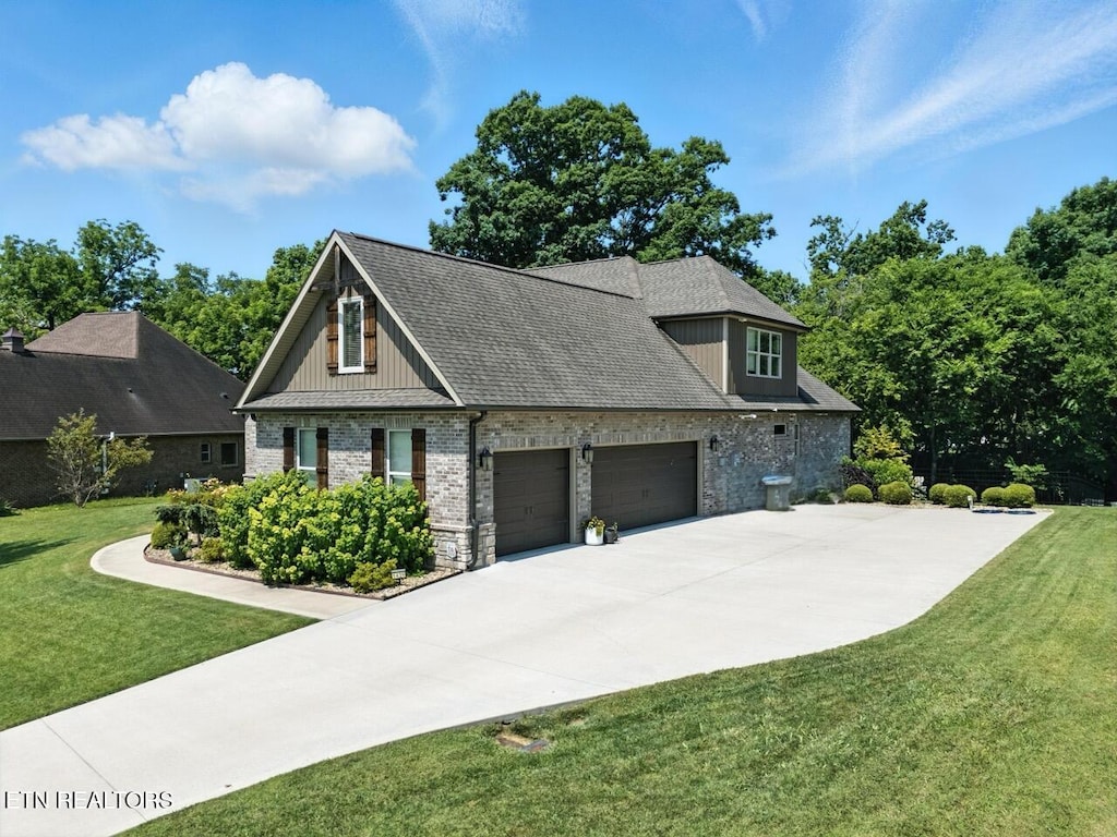 1439 St Thomas Way, Alcoa, TN 37701 - craftsman inspired home with an attached garage, a front lawn, concrete driveway, brick siding, and stone siding