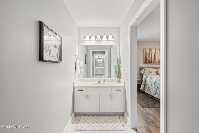 121 Fallberry St, Oak Ridge, TN 37830 - ensuite bathroom featuring vanity and wood finished floors