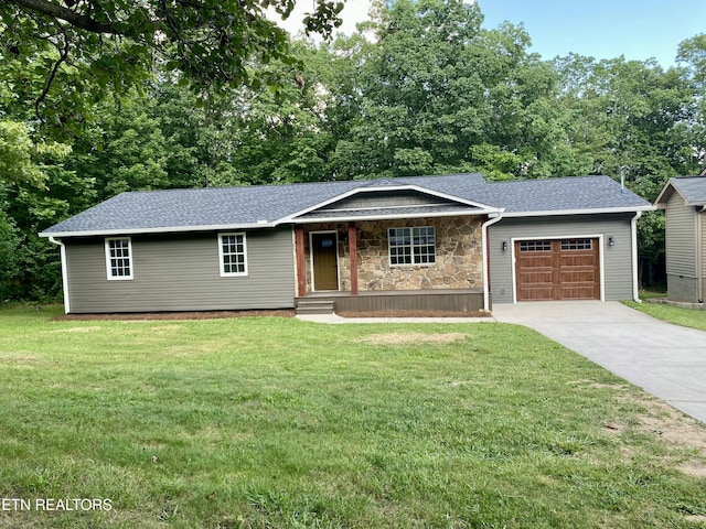 506 Snead Dr, Crossville, TN 38572 - single story home with a garage, driveway, covered porch, a front yard, and stone siding