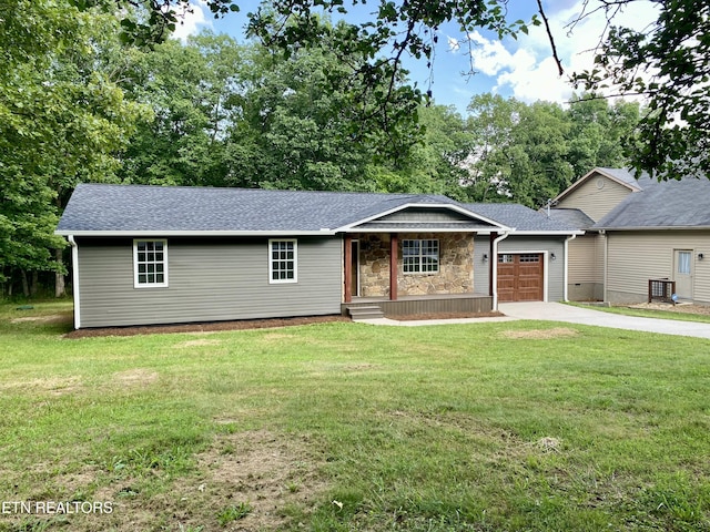 506 Snead Dr, Crossville, TN 38572 - ranch-style home with driveway, an attached garage, and a front yard