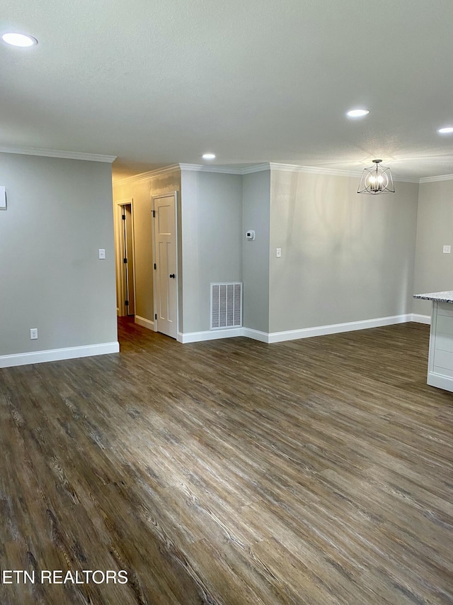 506 Snead Dr, Crossville, TN 38572 - unfurnished living room featuring crown molding, recessed lighting, dark wood-style floors, and a chandelier
