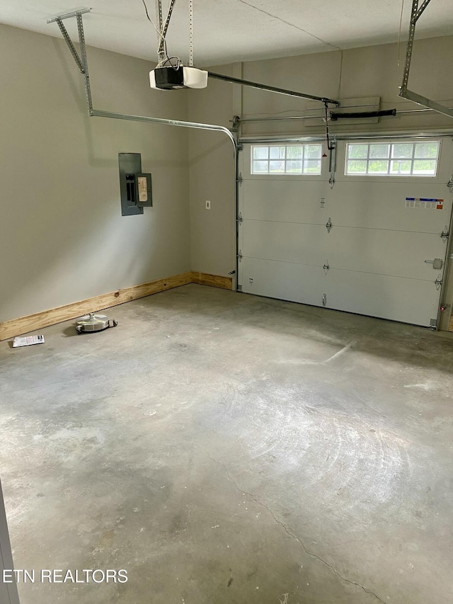 506 Snead Dr, Crossville, TN 38572 - garage featuring electric panel and a garage door opener