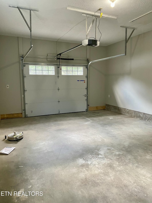 506 Snead Dr, Crossville, TN 38572 - garage featuring a garage door opener and baseboards
