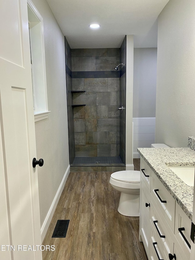 506 Snead Dr, Crossville, TN 38572 - full bath with wood finished floors, vanity, and tiled shower