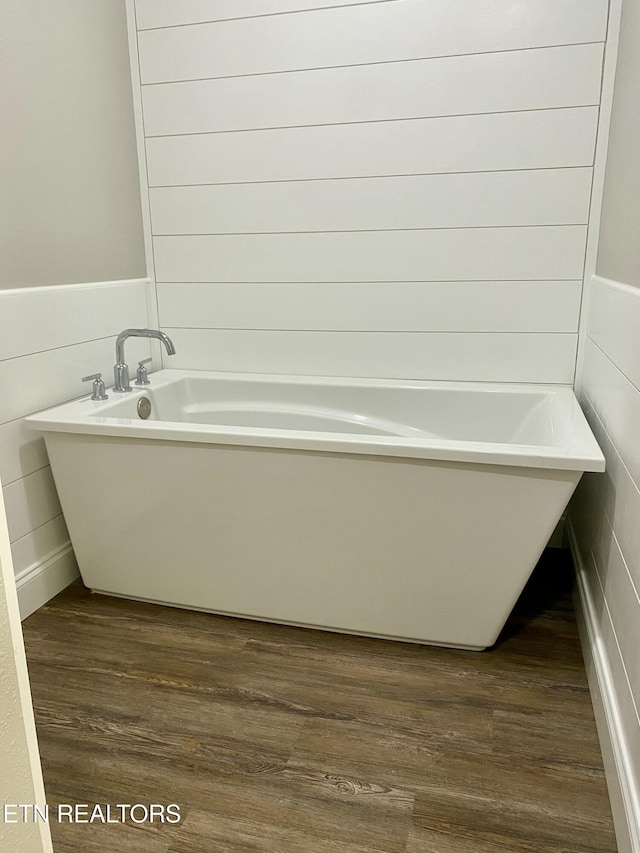 506 Snead Dr, Crossville, TN 38572 - full bath with wood finished floors, a freestanding tub, and a wainscoted wall