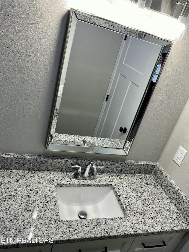 506 Snead Dr, Crossville, TN 38572 - bathroom featuring vanity and a textured wall