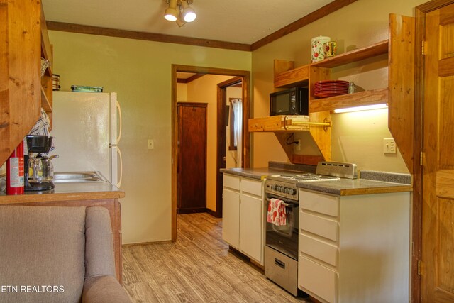 3636 Pickett Park Hwy, Jamestown, TN 38556 - kitchen featuring stainless steel range oven, black microwave, ornamental molding, light wood finished floors, and open shelves