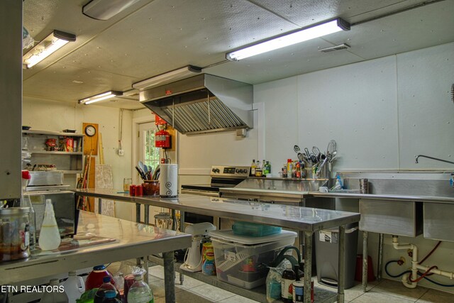 3636 Pickett Park Hwy, Jamestown, TN 38556 - kitchen with stainless steel range with electric stovetop, island exhaust hood, stainless steel counters, and tile patterned floors