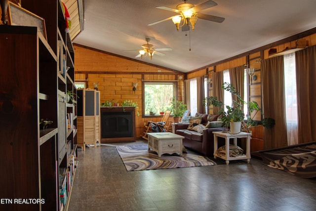 3636 Pickett Park Hwy, Jamestown, TN 38556 - living area with vaulted ceiling, wooden walls, a fireplace, a ceiling fan, and tile patterned floors