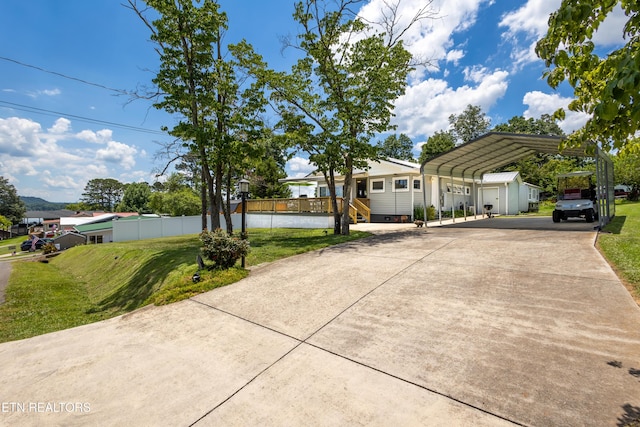 1595 Wa Ni Village Rd, Rutledge, TN 37861 - view of front of home featuring a carport and driveway