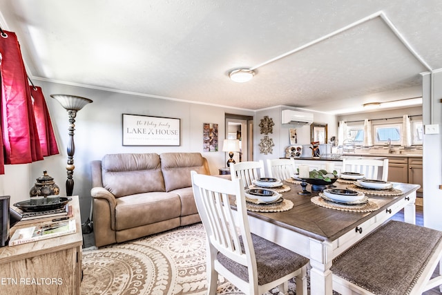 1595 Wa Ni Village Rd, Rutledge, TN 37861 - dining room with an AC wall unit, crown molding, and a textured ceiling