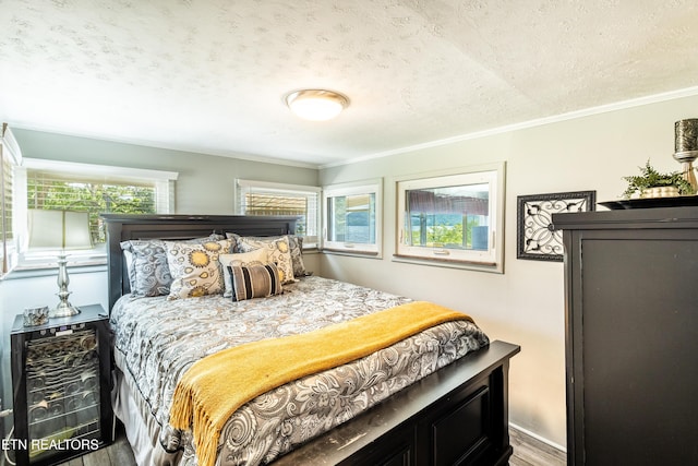 1595 Wa Ni Village Rd, Rutledge, TN 37861 - bedroom featuring a textured ceiling, wood finished floors, and crown molding